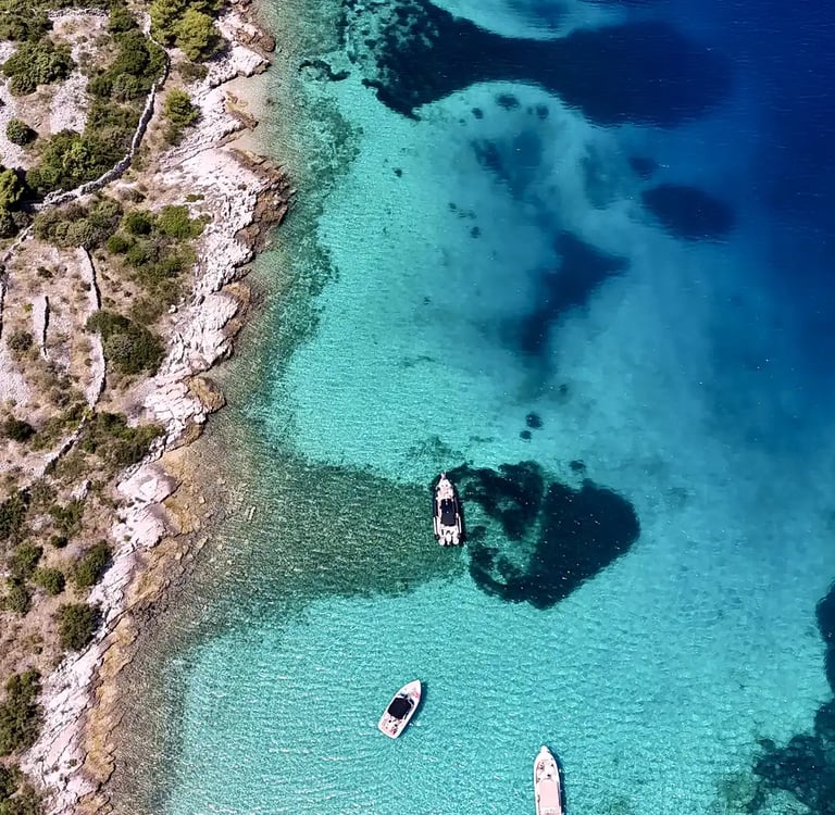 Aerial panoramic view of Drvenik Mali Island, seen on a private boat tour off the coast of Split, Croatia.