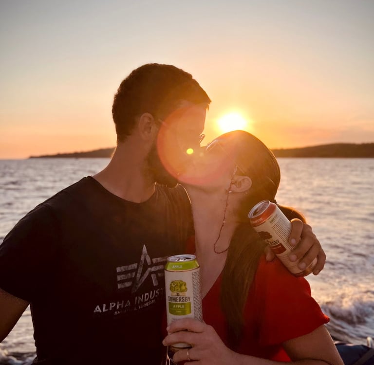 A couple is kissing in Split Croatia during romantic Sunset Boat Tour