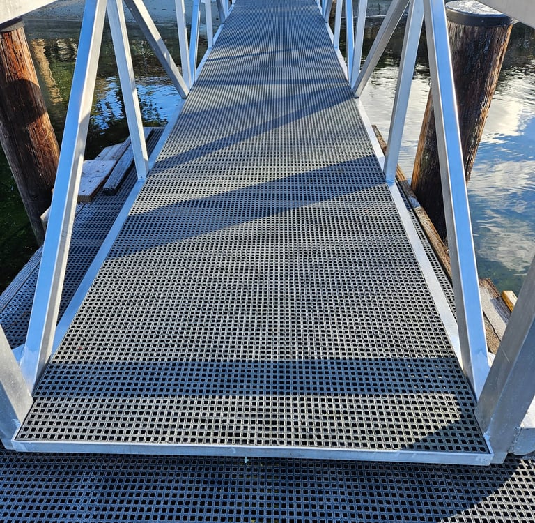Commercial Marina Dock Gangway with FRP mesh installed.