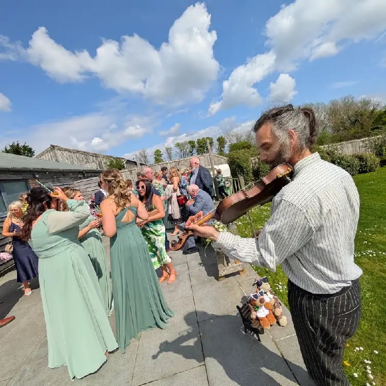 A professional fiddler performing a drinks reception with Rowans ceilidh band