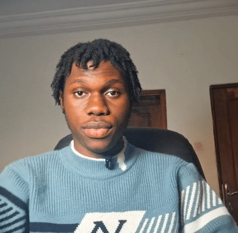 a man in a blue sweater and a blue sweater