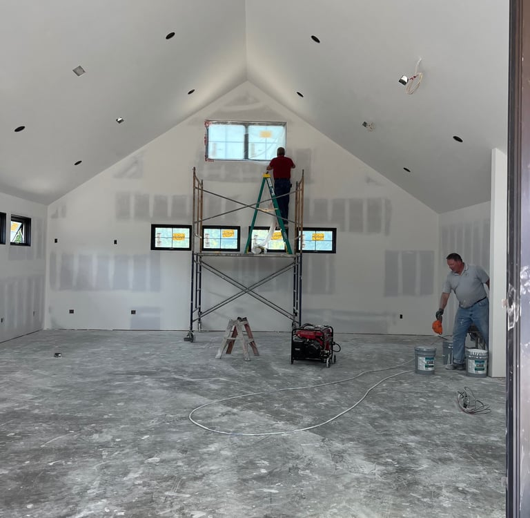 C&B Drywall crew mudding & taping at residential home