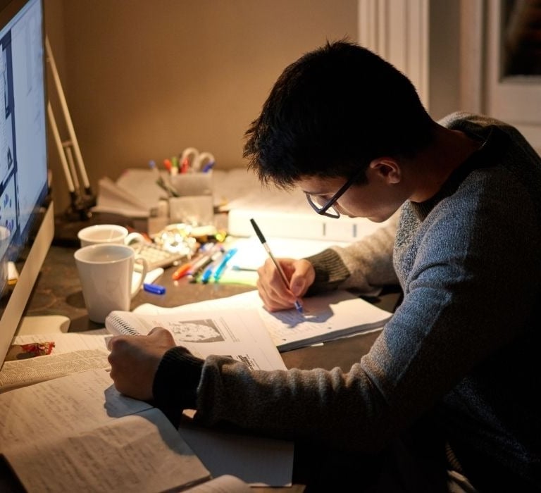college student at desk studying