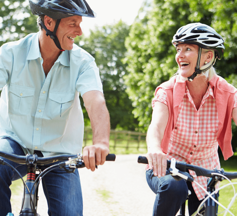 retired couple riding bikes in The Villages, FL