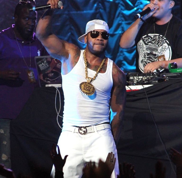 flo rida in white hat, white tank shirt and white pants performing