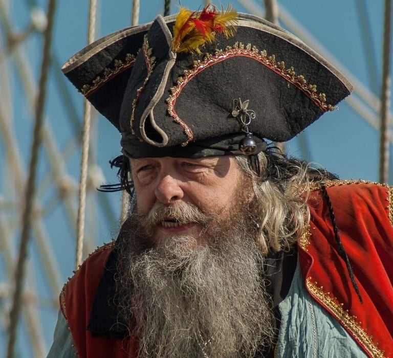 man dressed as pirate with hat and beard