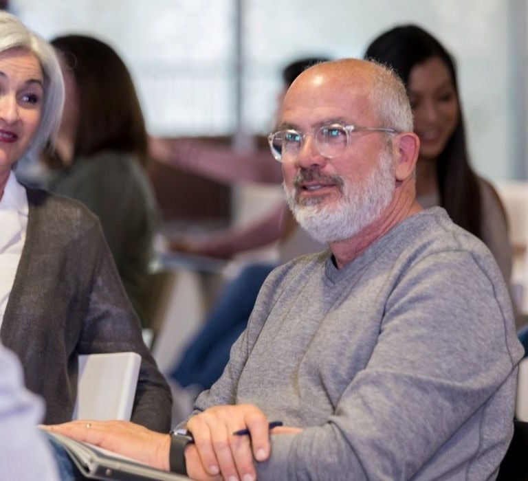 woman and man talking at a meeting