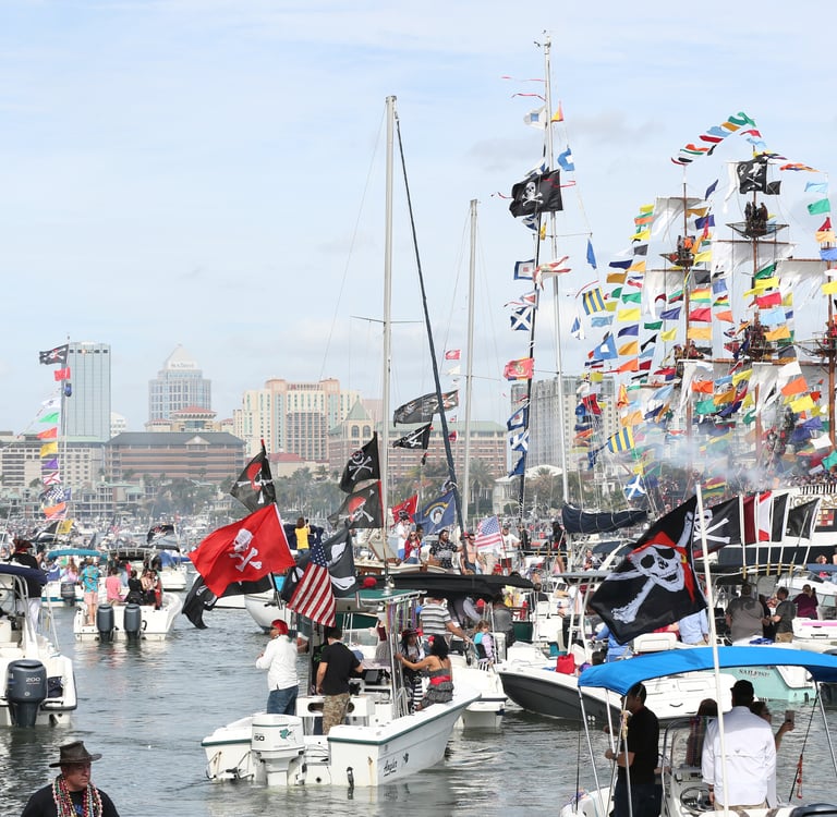 many boats in water at gasparilla invasion in Tampa, Florida