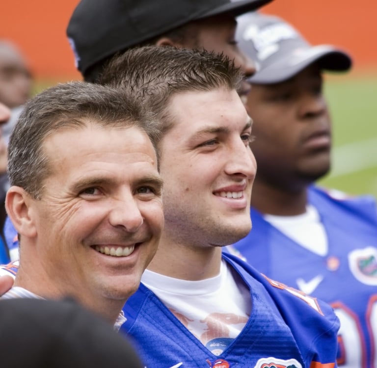tim tebow and urban meyer at university of florida football game