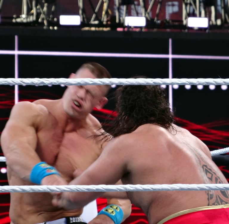 two wrestlers fighting in ring