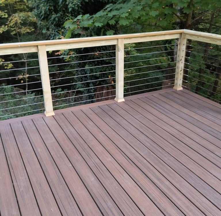 Close-up of natural wood deck railing showing craftsmanship and clean construction details