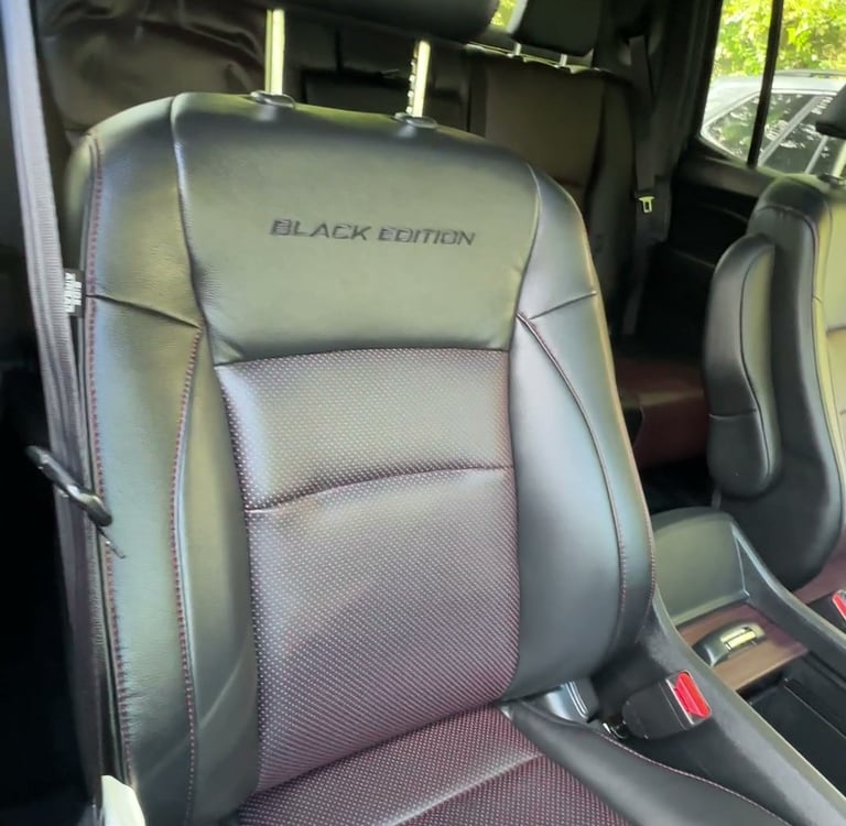 professional car detailing of interior leather seats for a special black edition truck