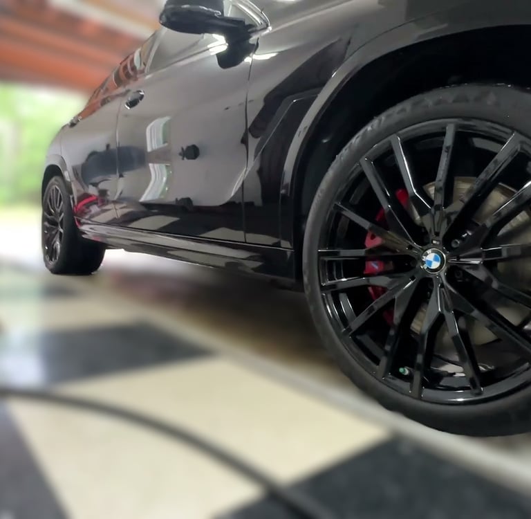 ceramic coating of paint and rims on a black bmw
