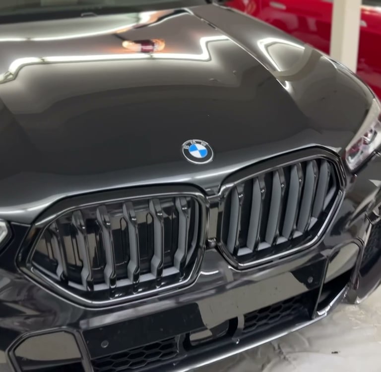 paint polished with ceramic coating of a black bmw suv
