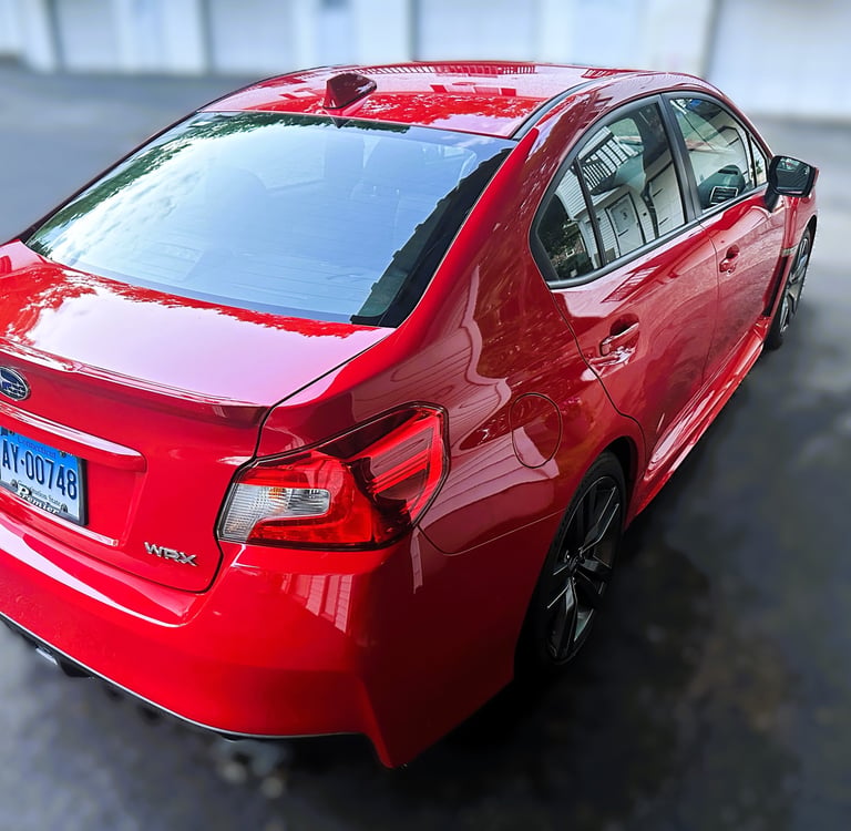 paint correction and ceramic coating of red subaru sports car