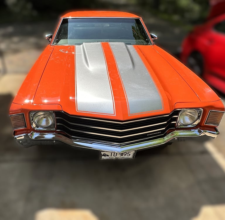 professionally mobile detailed orange muscle car with grey double stripes