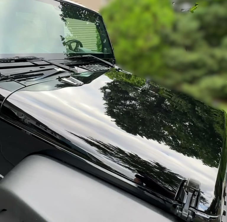 glossy black jeep after car detailing in ct neighborhood