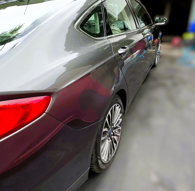 ceramic coating on a grey sedan