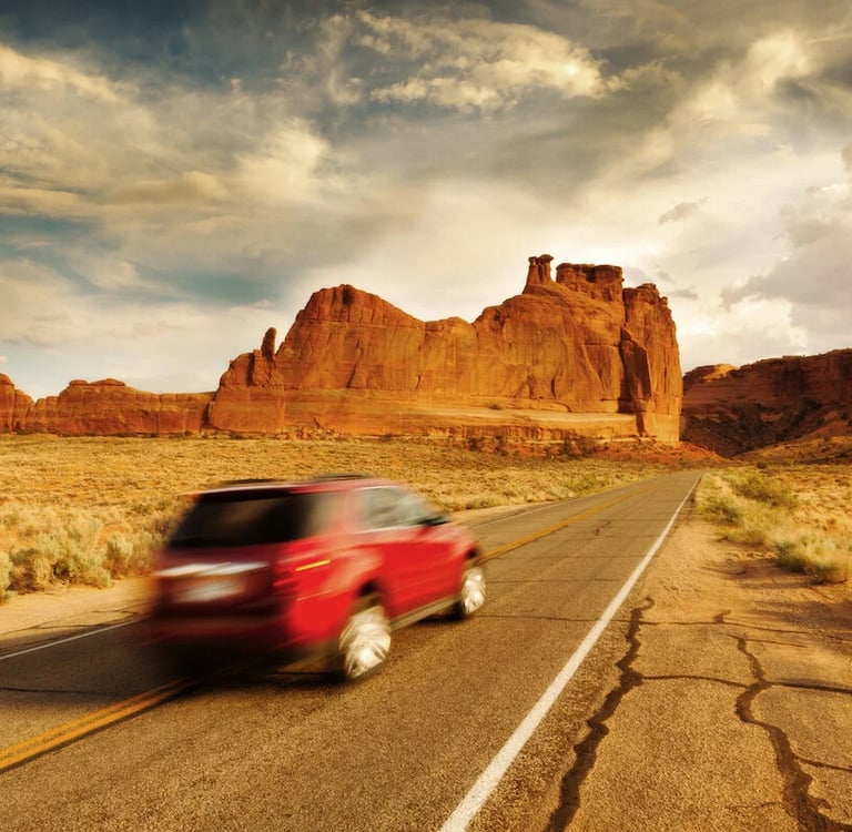 SUV speeding through desert landscape – embodying affordable cars Four Corners SUV on open roads