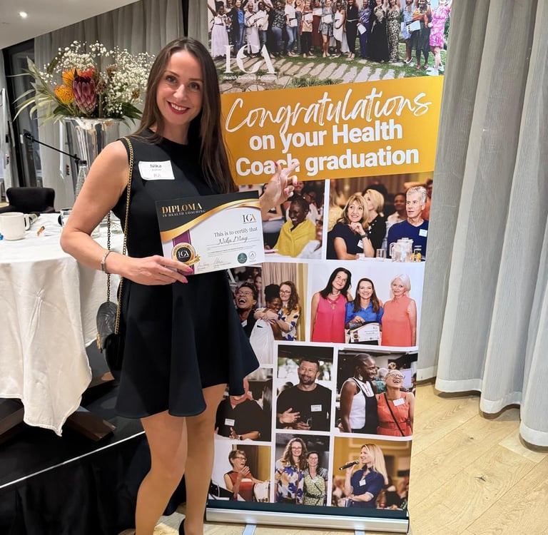 Nika May, qualified Health and Wellbeing Coach, at her graduation ceremony