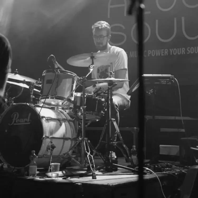 Close-up of Mosaic's drummer performing a high-energy rhythm set at a wedding reception