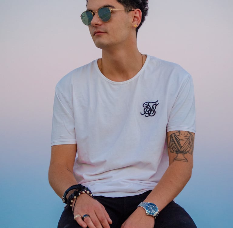 Man with glasses looking outside