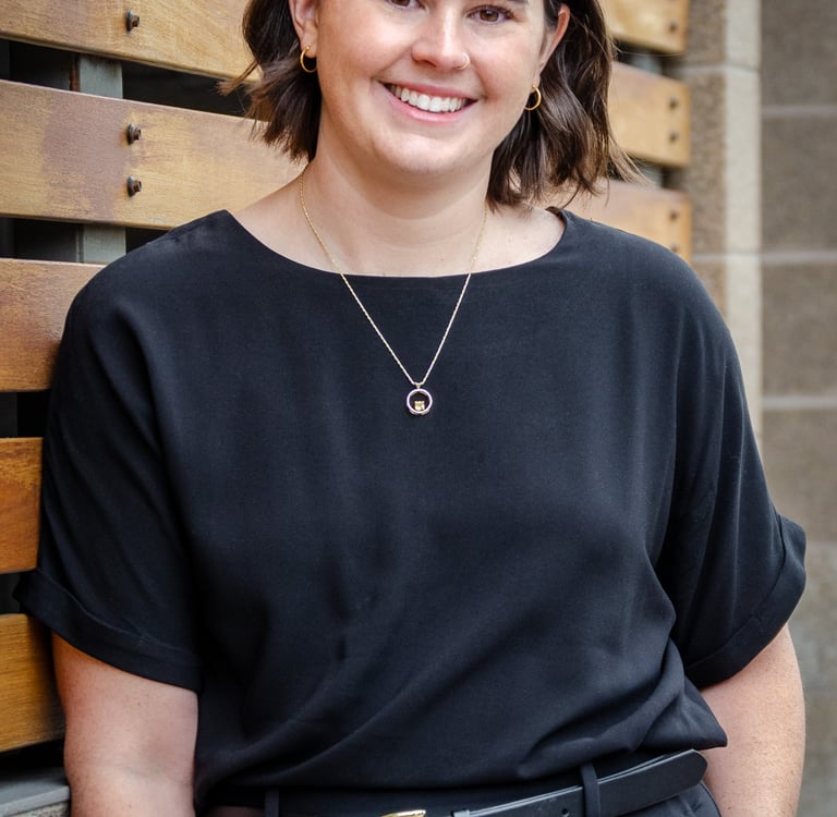 Female Optometrist in Loveland Colorado smiling and welcoming patients to Edge Optics