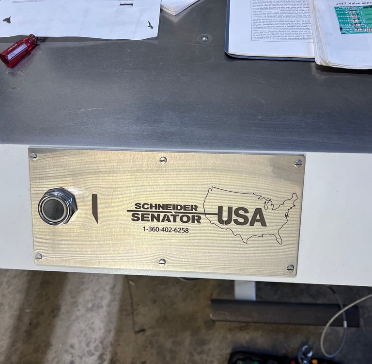 Stainless steel cut button cover for industrial paper cutter with cutouts for cut button and screws