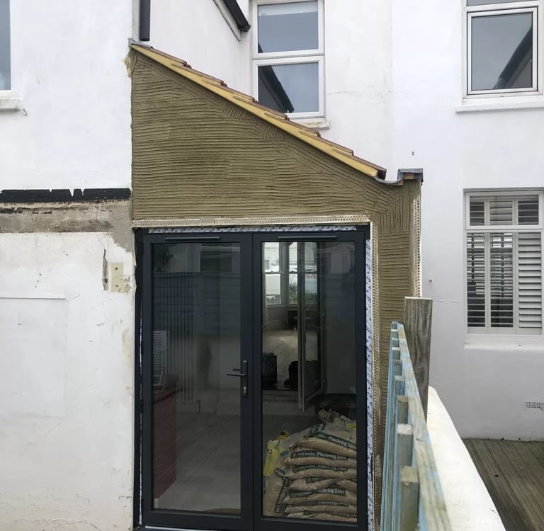 Rear house extension with new patio doors on Brighton property.