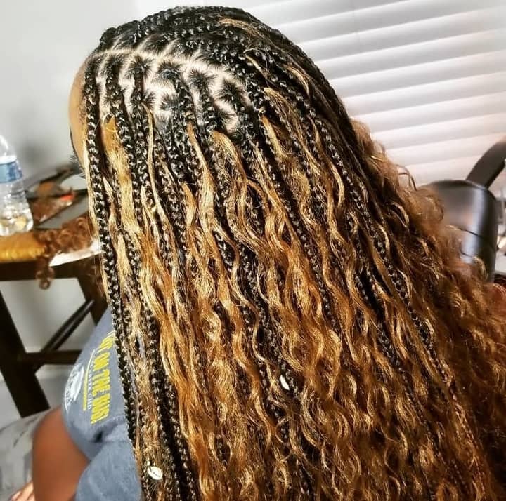 a woman with long bohobraids
