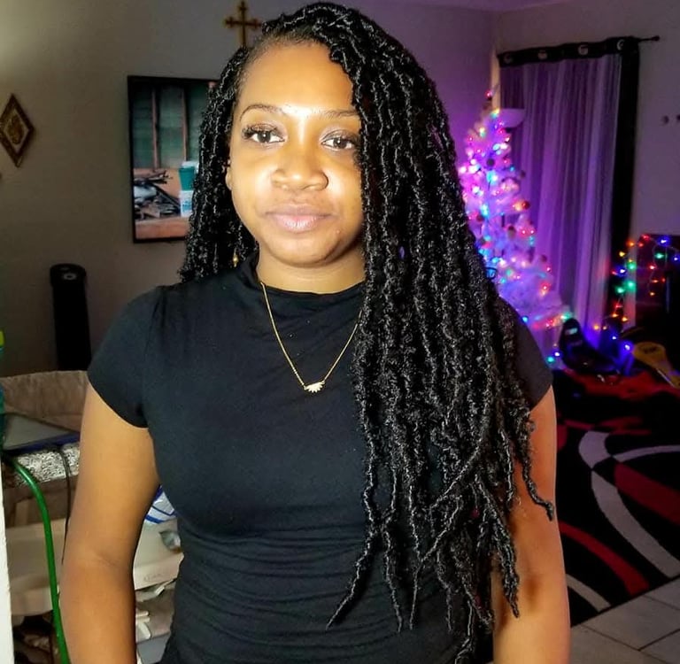 a woman with long black locs 