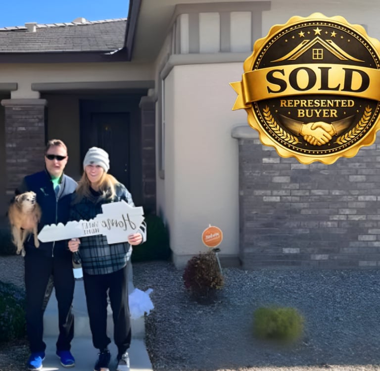a man and woman standing in front of a sold sign