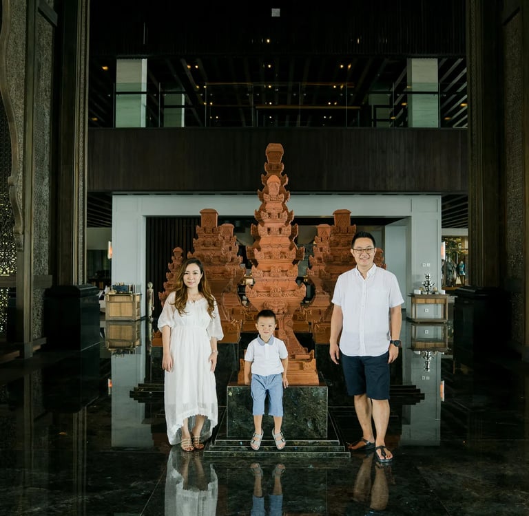 Family walking inside The Grand Lobby at The Apurva Kempinski Bali during a luxury family photography session in Nusa Dua