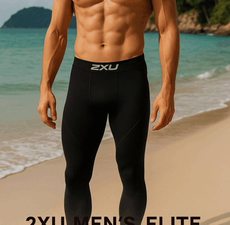 a man in black 2XU compression tights on a Thai beach with turquoise water in the background