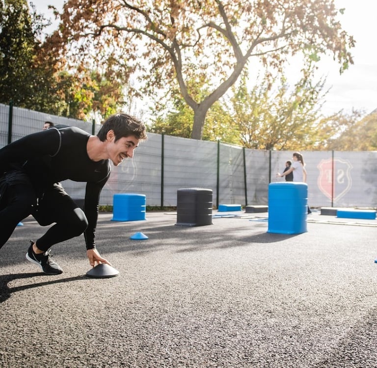 a man over 40 in a black compression tights exercising outdoors 