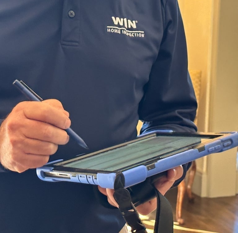 “Inspector writing notes — digital photo reports for seasonal homes