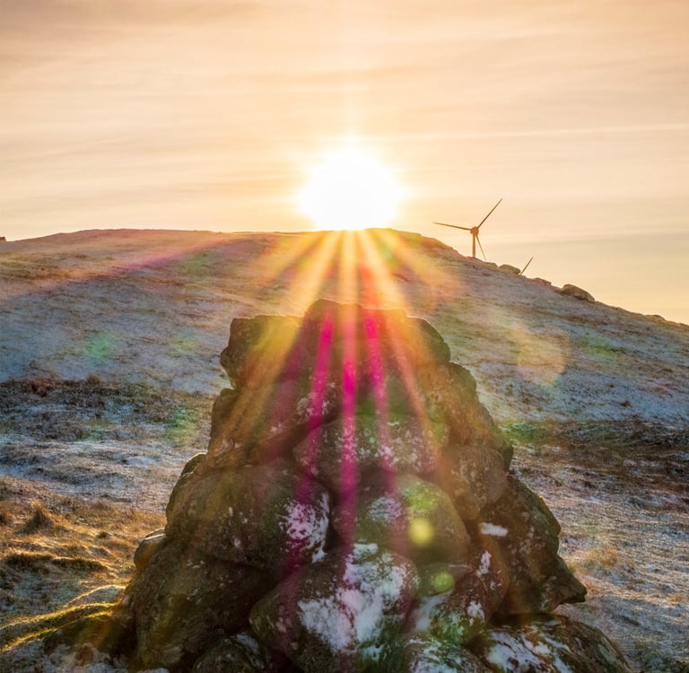 A cairn in the Faroe Islands during sunset