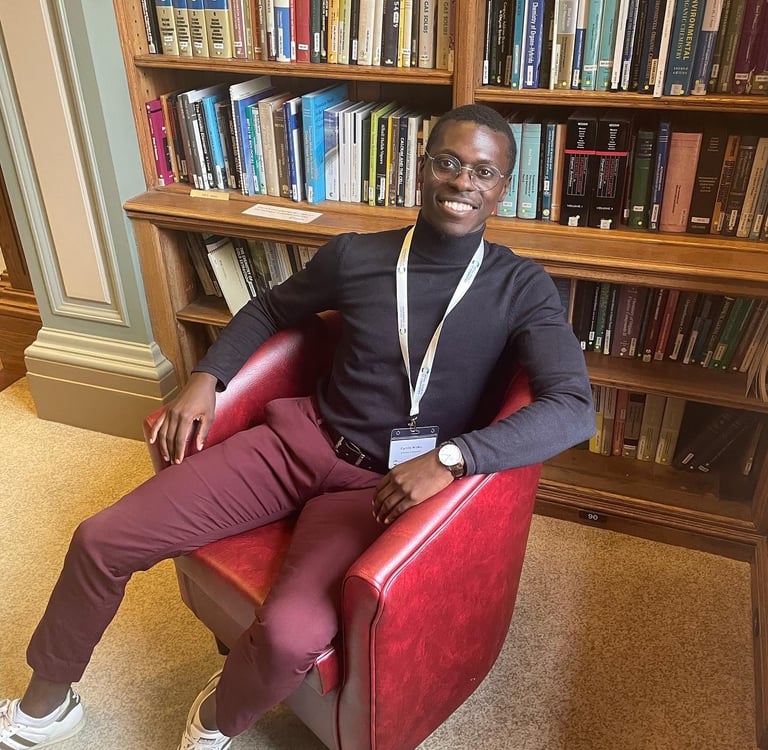 a man sitting in a chair in a library