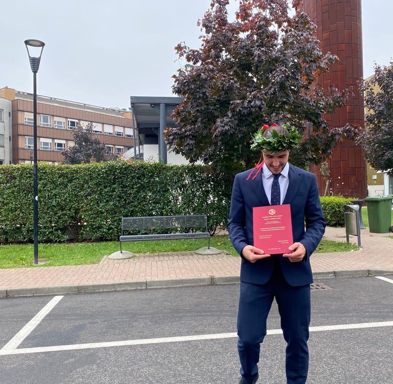 a man in a suit and tie is holding a certificate