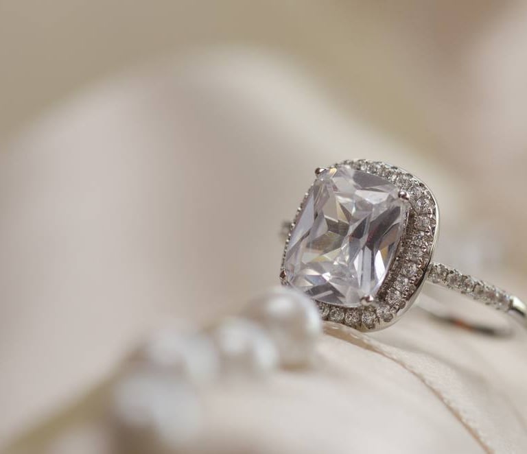 a ring with a CVD Lab-Grown Diamonds ring and a pearl ring