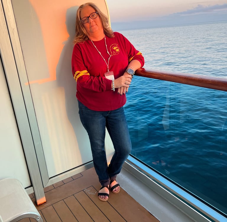 Shelly on a balcony of a Carnival Cruise to Alaska 
