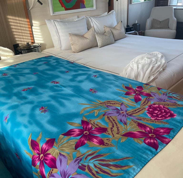 a massage table with a blue blanket in the bedroom on a yacht