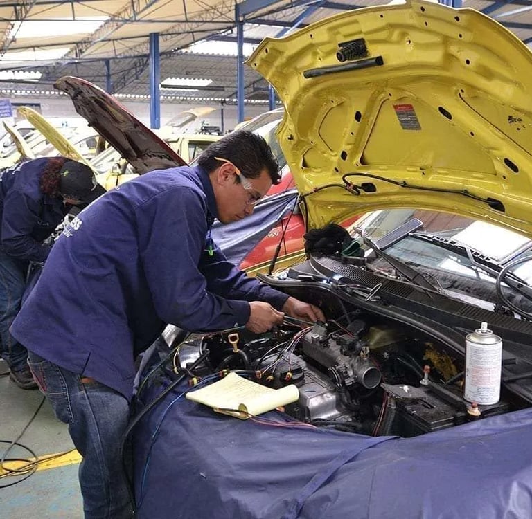 a man working on a car in a garage