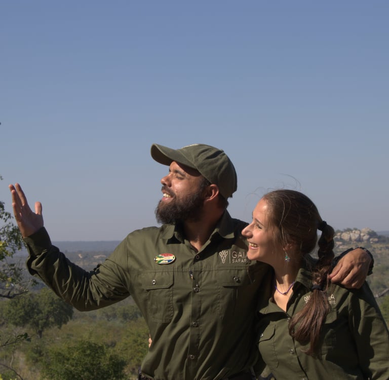 Gaia Safaris founders in African wilderness, sharing passion for conservation and community.