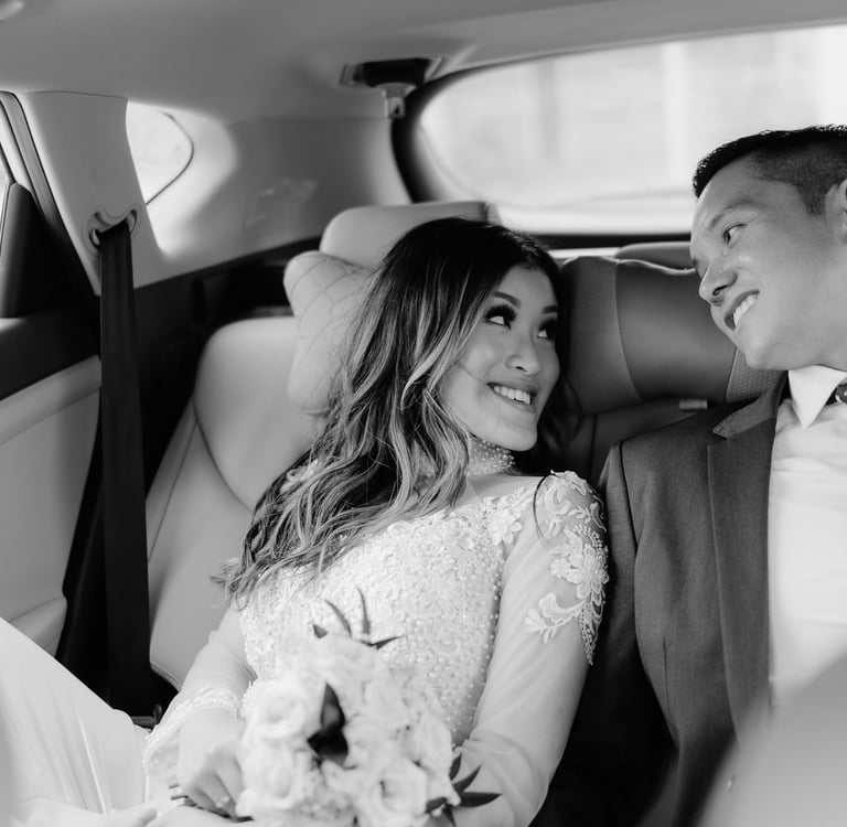 a bride and groom in a car