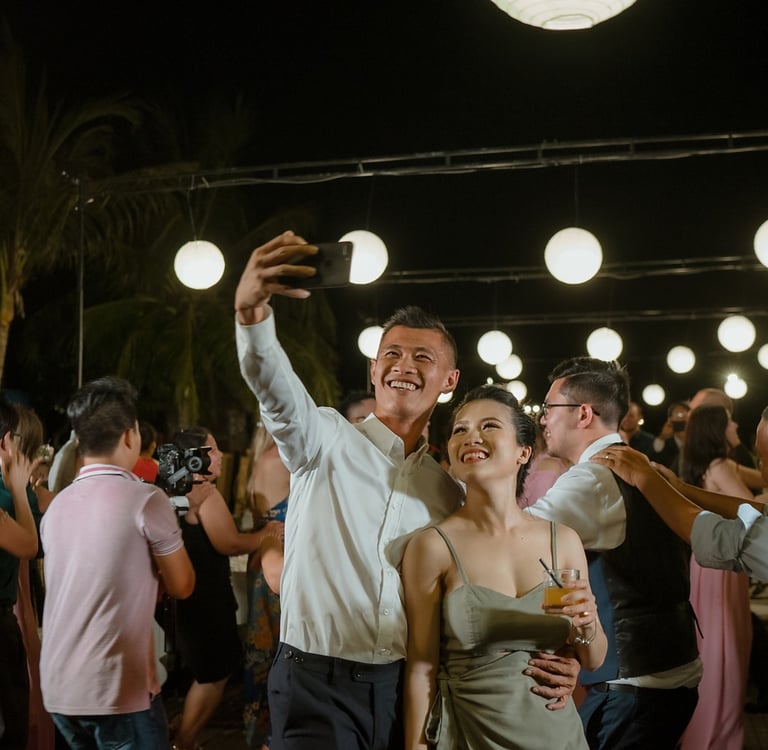 a man and woman dancing at a party