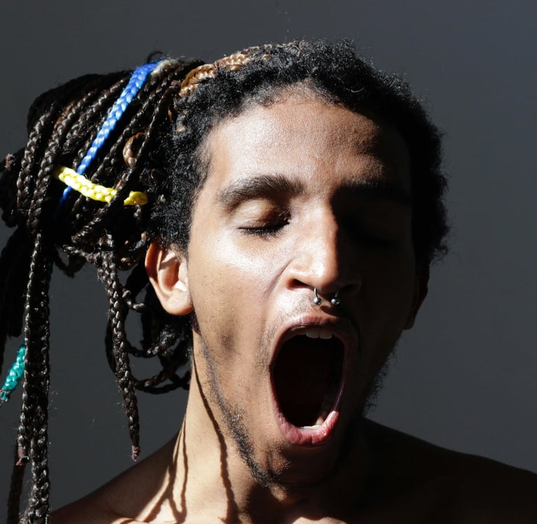 a man with dreadlocks and dreadlocks on his head