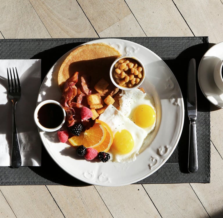a breakfast plate with eggs, toasted eggs, and toasted eggs