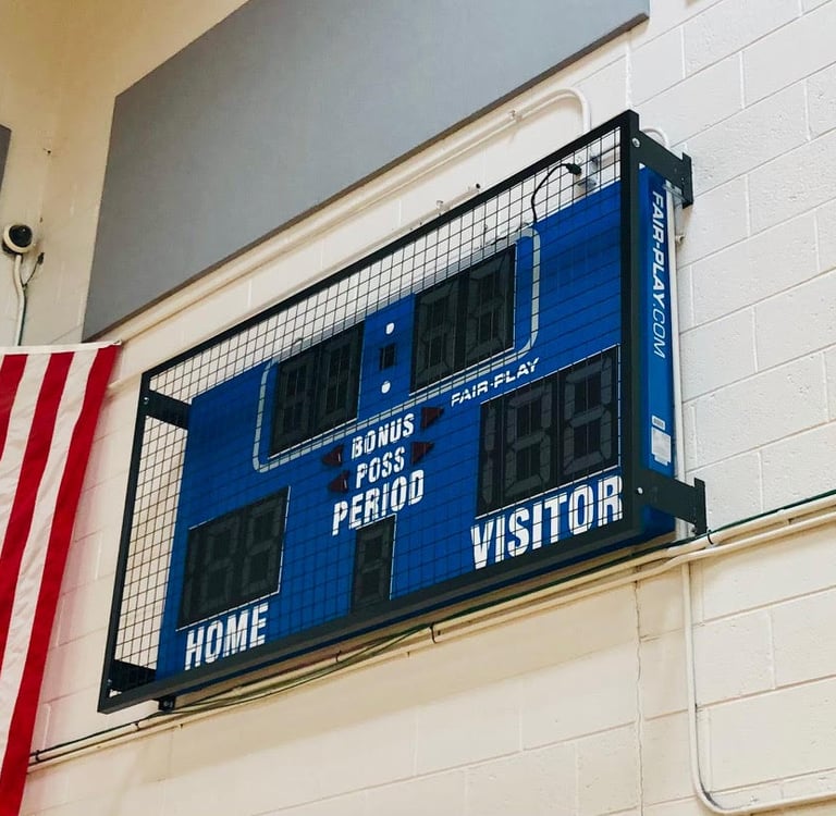 Scoreboard with wire mesh protective screen installed in Burlington NJ by Degler Whiting Inc
