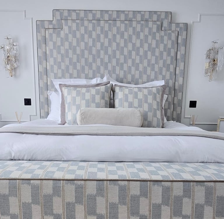 Elegant master bedroom with a modern bed, stylish decor, and ambient lighting